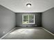 Cozy bedroom with neutral carpeting, natural light, and a serene atmosphere at 5142 Golfbrook Ct, Stone Mountain, GA 30088
