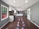 Spacious kitchen featuring wood floors, sleek appliances, modern cabinets, and generous natural light at 5142 Golfbrook Ct, Stone Mountain, GA 30088