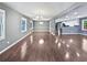 Open-concept living space featuring wood floors, recessed lighting, and easy kitchen access at 5142 Golfbrook Ct, Stone Mountain, GA 30088