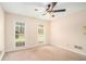 Bedroom with carpet, ceiling fan, and windows that provide lots of natural light at 5633 Southland Dr, Stone Mountain, GA 30087