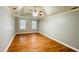 Spacious bedroom featuring hardwood floors, neutral paint, and ample natural light at 5633 Southland Dr, Stone Mountain, GA 30087
