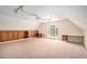 Spacious bonus room featuring built-in shelving, cabinets, desk space, and a large window for natural light at 5633 Southland Dr, Stone Mountain, GA 30087