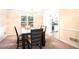 Elegant dining room features a modern table with seating for six under a beautiful chandelier fixture at 5633 Southland Dr, Stone Mountain, GA 30087