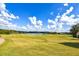Scenic view of the well-manicured golf course and lake featuring green spaces and luxurious community living at 5633 Southland Dr, Stone Mountain, GA 30087
