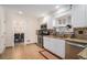 Well-equipped kitchen with stainless steel appliances, granite counters and tiled flooring leading to the dining room at 5633 Southland Dr, Stone Mountain, GA 30087