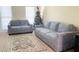 Cozy living room featuring comfortable seating arrangements and a decorative rug at 5633 Southland Dr, Stone Mountain, GA 30087