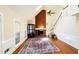 Bright living room with a brick fireplace, staircase, and plenty of natural light at 5633 Southland Dr, Stone Mountain, GA 30087