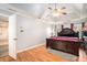 Spacious primary bedroom featuring a tray ceiling and large window with views at 5633 Southland Dr, Stone Mountain, GA 30087