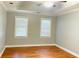 Spacious main bedroom featuring hardwood floors, neutral paint, and ample natural light at 5633 Southland Dr, Stone Mountain, GA 30087