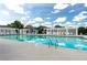 Community swimming pool surrounded by lounge chairs and covered seating areas, perfect for relaxation and recreation at 5633 Southland Dr, Stone Mountain, GA 30087