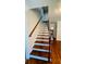 Elegant staircase featuring wood treads and railings at 5633 Southland Dr, Stone Mountain, GA 30087