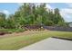 Back yard featuring landscaping, trees, and fence at 7570 Rambling Vale, Cumming, GA 30028