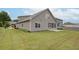 Spacious backyard featuring a well-maintained lawn, screened porch and lush perimeter landscaping at 7570 Rambling Vale, Cumming, GA 30028