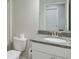 Bathroom featuring vanity with granite countertop, modern fixtures, and tiled floors at 7570 Rambling Vale, Cumming, GA 30028