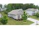 Charming one-story home with brick accents, well-manicured lawn, and a concrete driveway at 7570 Rambling Vale, Cumming, GA 30028