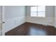 Office space with wainscotting, wood floors, and a window at 7570 Rambling Vale, Cumming, GA 30028