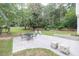 Expansive backyard with a patio, outdoor furniture, and wooded views at 2101 Emerald Dr, Loganville, GA 30052