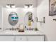 Elegant bathroom features dual sinks, marble countertops, and modern lighting at 2101 Emerald Dr, Loganville, GA 30052