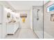 Contemporary bathroom features a glass shower, sleek vanity, and elegant neutral finishes at 2101 Emerald Dr, Loganville, GA 30052