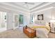 Inviting bedroom with access to the bathroom and French doors to the outdoor deck at 2101 Emerald Dr, Loganville, GA 30052