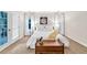Bright bedroom boasts white walls, soft carpet, and a bed adorned with white linens at 2101 Emerald Dr, Loganville, GA 30052