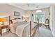 Bedroom featuring a well-made bed, a nightstand, and natural light from a window at 2101 Emerald Dr, Loganville, GA 30052