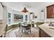 Bright breakfast nook with large windows, cozy seating, and views of the outdoor landscape at 2101 Emerald Dr, Loganville, GA 30052