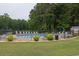 Enjoy the community pool surrounded by lounge chairs and lush greenery for relaxation at 2101 Emerald Dr, Loganville, GA 30052