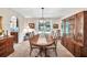 Elegant dining room with classic furniture, large windows, and an archway leading to the living room at 2101 Emerald Dr, Loganville, GA 30052