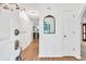 Bright foyer with hardwood floors, a decorative mirror, and an open view into the adjoining rooms at 2101 Emerald Dr, Loganville, GA 30052