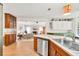 Bright kitchen featuring stainless appliances, wood cabinets, with open flow to living space at 2101 Emerald Dr, Loganville, GA 30052