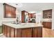 Well-lit kitchen showcasing wood cabinetry, stainless steel appliances, and hardwood floors at 2101 Emerald Dr, Loganville, GA 30052