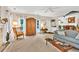 Spacious living room boasting large windows, hardwood floors, and open access to kitchen at 2101 Emerald Dr, Loganville, GA 30052
