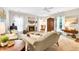 Inviting living room featuring a fireplace, ample natural light, and comfortable furnishings at 2101 Emerald Dr, Loganville, GA 30052