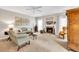 Cozy living room with fireplace, neutral carpet, lots of natural light, and stylish decor at 2101 Emerald Dr, Loganville, GA 30052