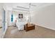 Serene main bedroom with tray ceiling, large windows, and ample space for relaxation at 2101 Emerald Dr, Loganville, GA 30052