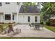 Enjoy outdoor relaxation on this cozy patio with comfortable seating and backyard access at 2101 Emerald Dr, Loganville, GA 30052