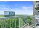 Balcony view features wooded skyline and high rise buildings under blue sky at 3300 Windy Ridge Se Pkwy # 1107, Atlanta, GA 30339
