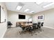 Bright conference room with a large table, TV, and comfortable seating at 3300 Windy Ridge Se Pkwy # 1107, Atlanta, GA 30339
