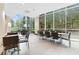Well-lit dining area with seating and large windows overlooking outdoor greenery at 3300 Windy Ridge Se Pkwy # 1107, Atlanta, GA 30339