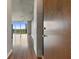 Modern apartment entryway with hardwood floors, concrete accents, and city view at 3300 Windy Ridge Se Pkwy # 1107, Atlanta, GA 30339
