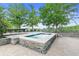 Rooftop hot tub featuring stone surround and green treeline views at 3300 Windy Ridge Se Pkwy # 1107, Atlanta, GA 30339