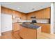 Modern kitchen featuring wood cabinets, granite countertops, stainless steel appliances, and an island at 3300 Windy Ridge Se Pkwy # 1107, Atlanta, GA 30339