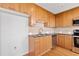 Modern kitchen featuring wood cabinets, granite countertops, and stainless steel appliances at 3300 Windy Ridge Se Pkwy # 1107, Atlanta, GA 30339