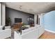 Modern living room with hardwood floors, ample seating, TV, and unique decor at 3300 Windy Ridge Se Pkwy # 1107, Atlanta, GA 30339
