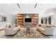 Cozy living room with modern built-ins, neutral tones, and comfortable seating arrangements at 3300 Windy Ridge Se Pkwy # 1107, Atlanta, GA 30339
