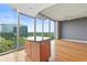Open living room featuring an island with granite countertop and walls of windows at 3300 Windy Ridge Se Pkwy # 1107, Atlanta, GA 30339