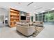 Bright lounge with sofas, decorative shelving, TV and large windows at 3300 Windy Ridge Se Pkwy # 1107, Atlanta, GA 30339