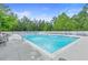 Resort-style pool with lounge chairs surrounded by lush greenery at 3300 Windy Ridge Se Pkwy # 1107, Atlanta, GA 30339
