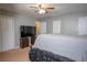 Main bedroom with neutral carpeting and a ceiling fan at 3963 Ferncliff Rd, Snellville, GA 30039